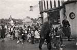 Children parade by the post office - 1950s Children parade by the post office - 1950s