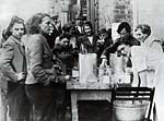 Giving out hot tea to civilians Giving out hot tea to civilians