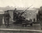 HomeGuard man an anti-aircraft gun. HomeGuard man an anti-aircraft gun.
